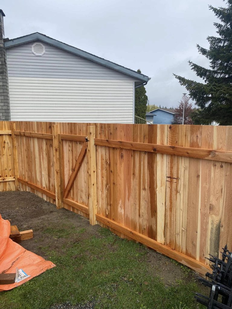 New wood fence and gate installation at residential property